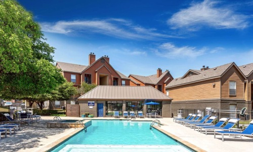 a swimming pool in front of a house