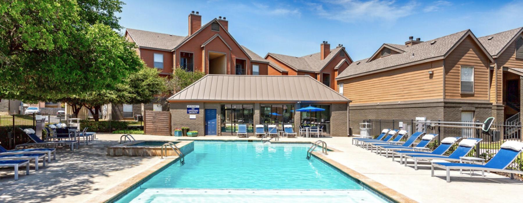 a swimming pool in front of a house