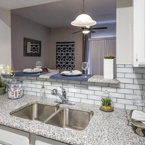 a kitchen with a marble countertop